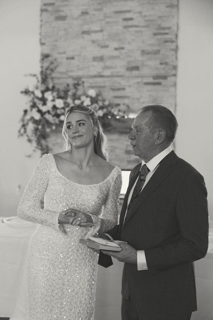 Bride and father of the bride during their first look before her wedding.
