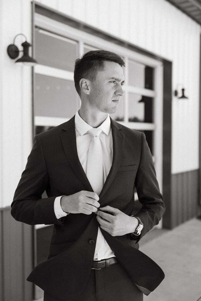 Groom getting ready for his wedding in Wichita wedding venue.