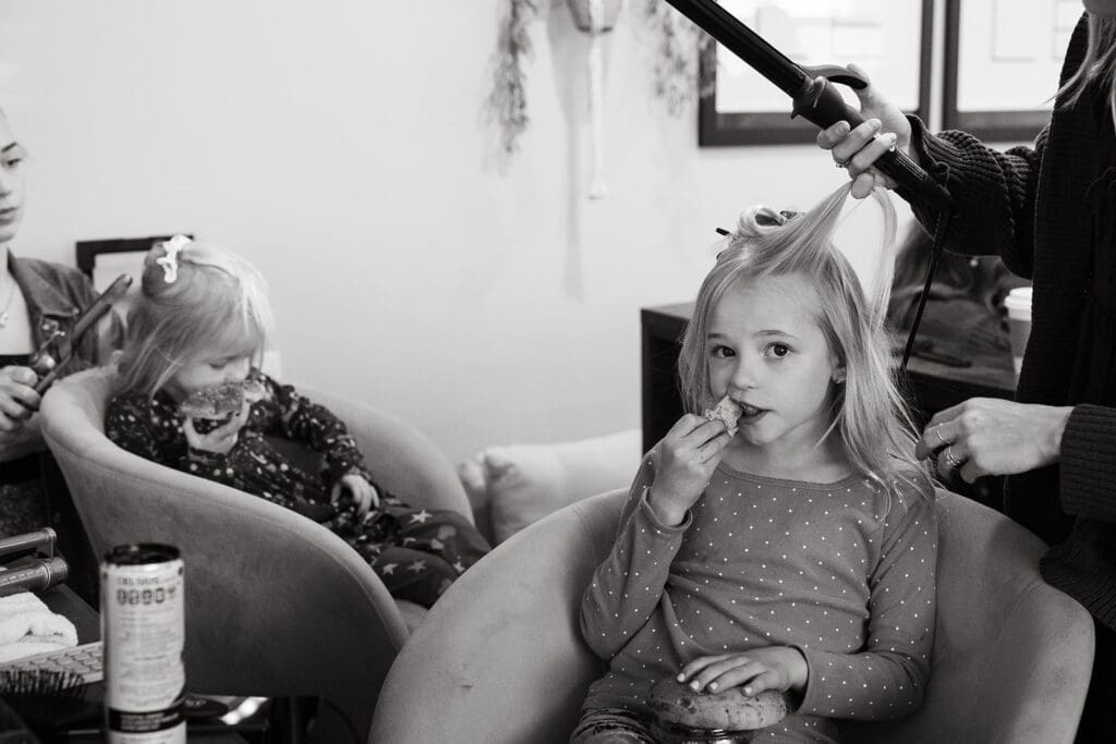 Two little girls getting ready for wedding day.