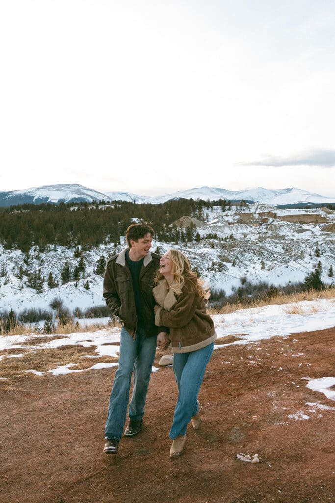 engagement photos taken in breckinridge colorado with a snowy mountain background