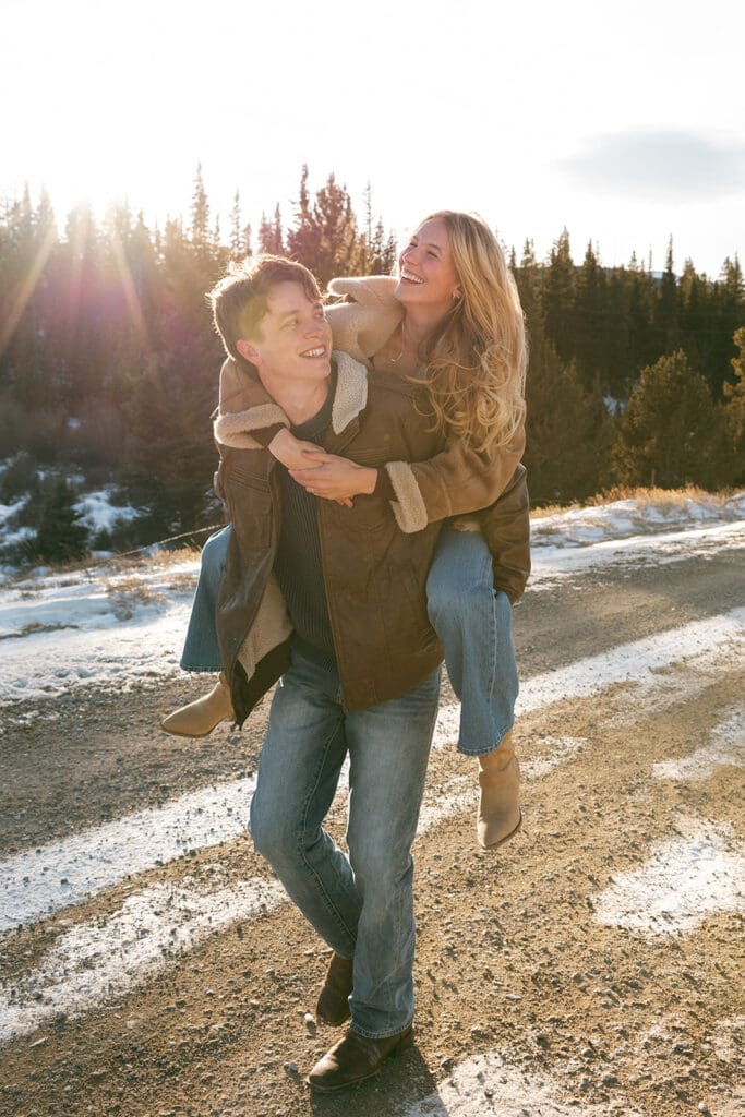 engagement photos taken in breckinridge colorado with a snowy mountain background