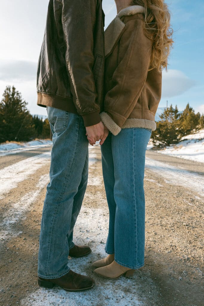 engagement photos taken in breckinridge colorado with a snowy mountain background