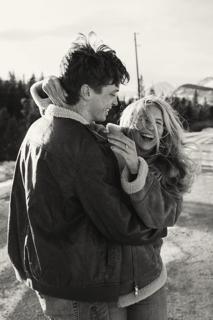 engagement photos taken in breckinridge colorado with a snowy mountain background