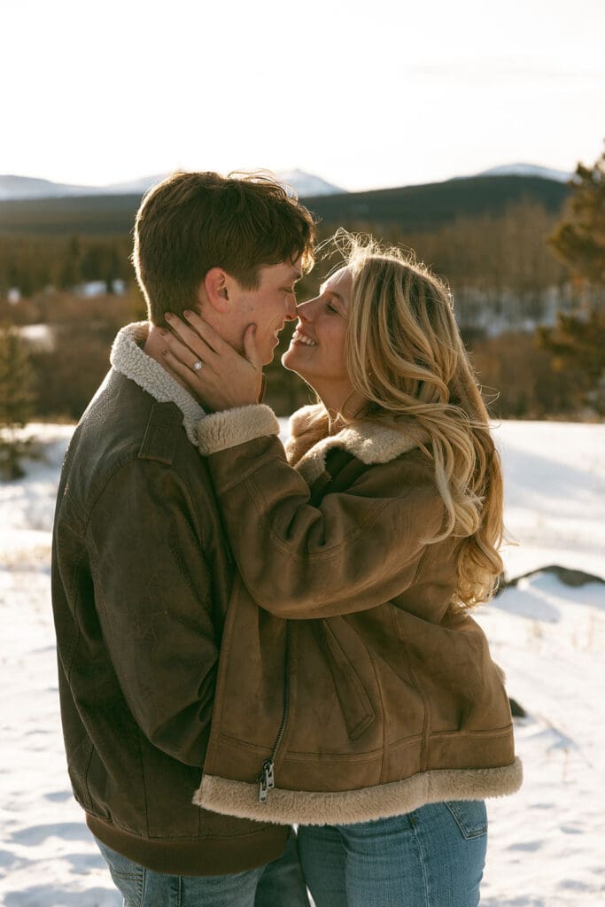 engagement photos taken in breckinridge colorado with a snowy mountain background