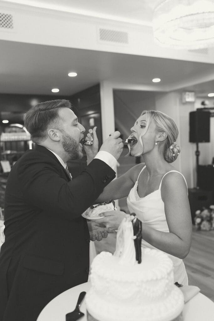 bride and groom cutting cake in melrose abbey in kansas city