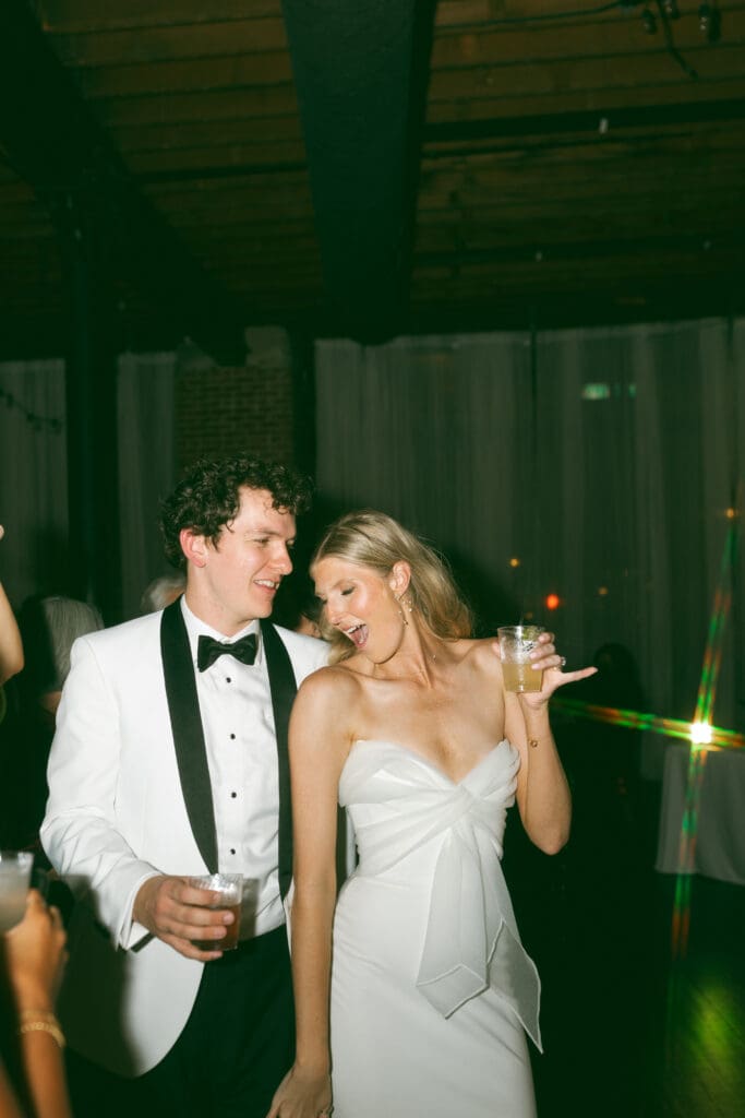 bride and groom dancing at elegant, luxurious, colorful reception in kansas city