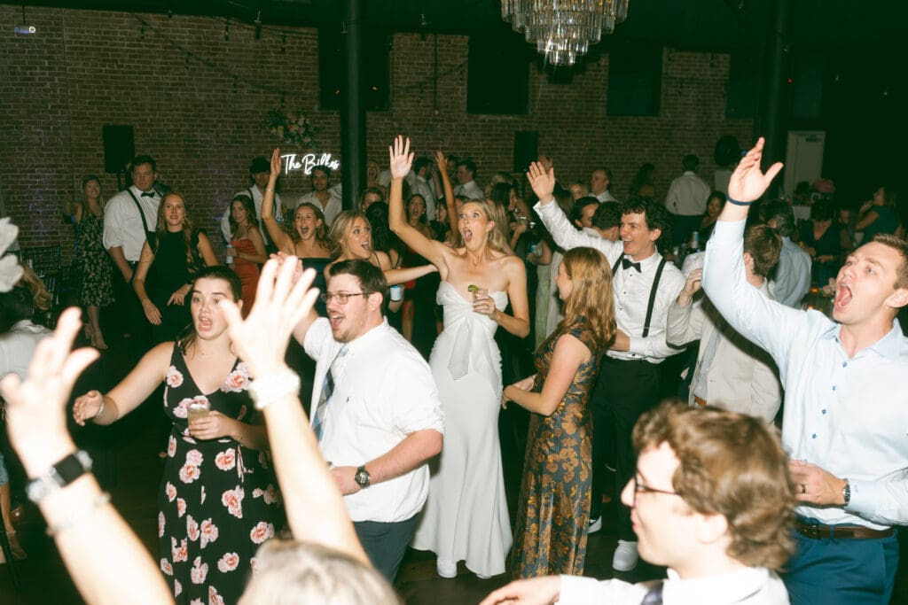 guests dancing at elegant, luxurious, colorful reception in kansas city