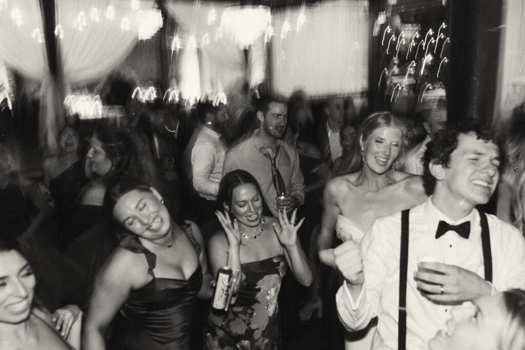 guests dancing at elegant, luxurious, colorful reception in kansas city