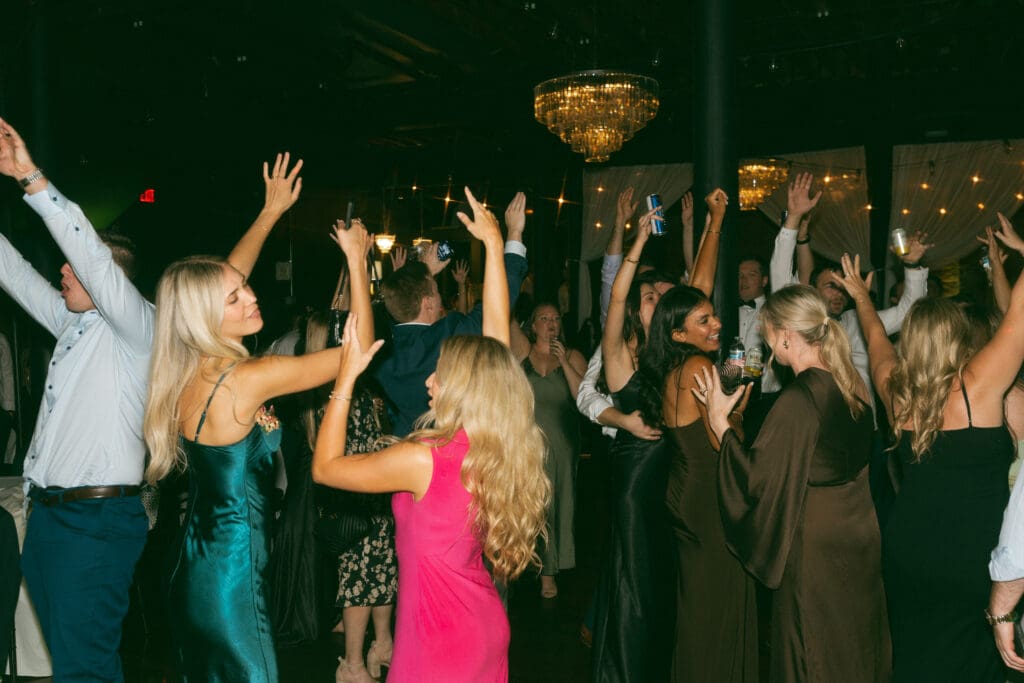 guests dancing at elegant, luxurious, colorful reception in kansas city