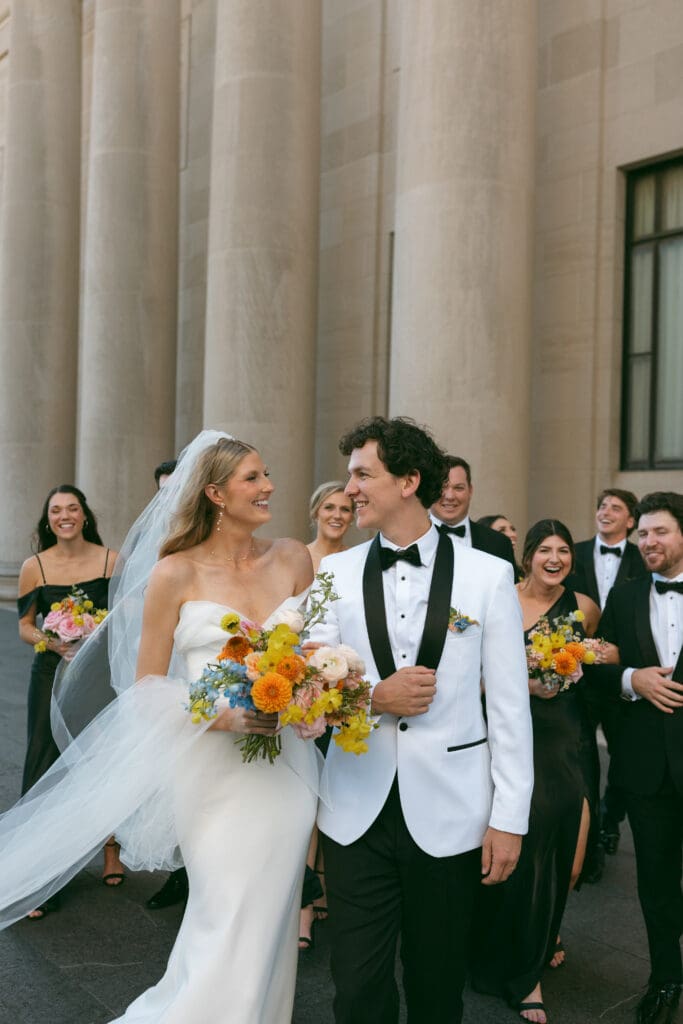 bride and groom and wedding party shot in colorful kansas city wedding