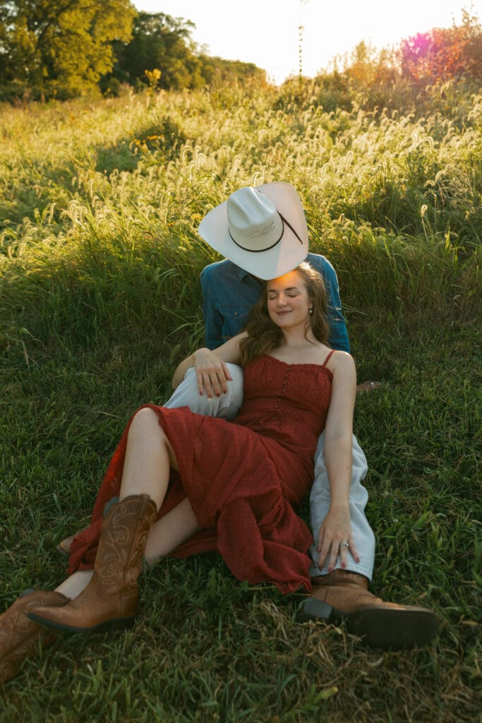 woman and man laughing during engagement session in kansas city