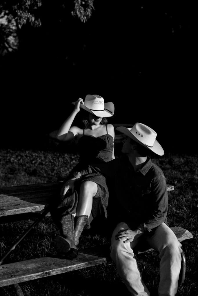 woman and man laughing during engagement session in kansas city