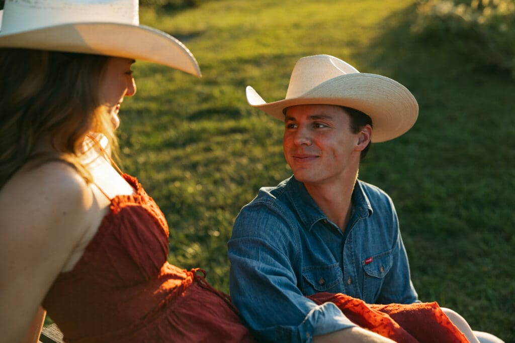 man looking lovingly at woman during engagement session in kansas city