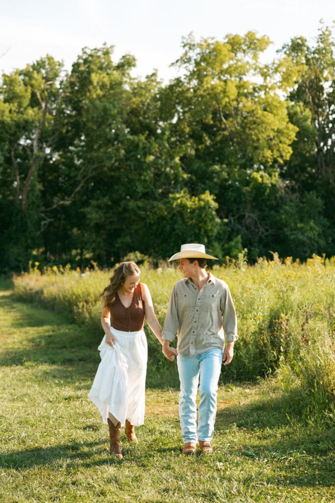 woman and man running during engagement session in kansas city