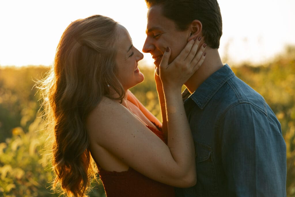 woman and man laughing during engagement session in kansas city