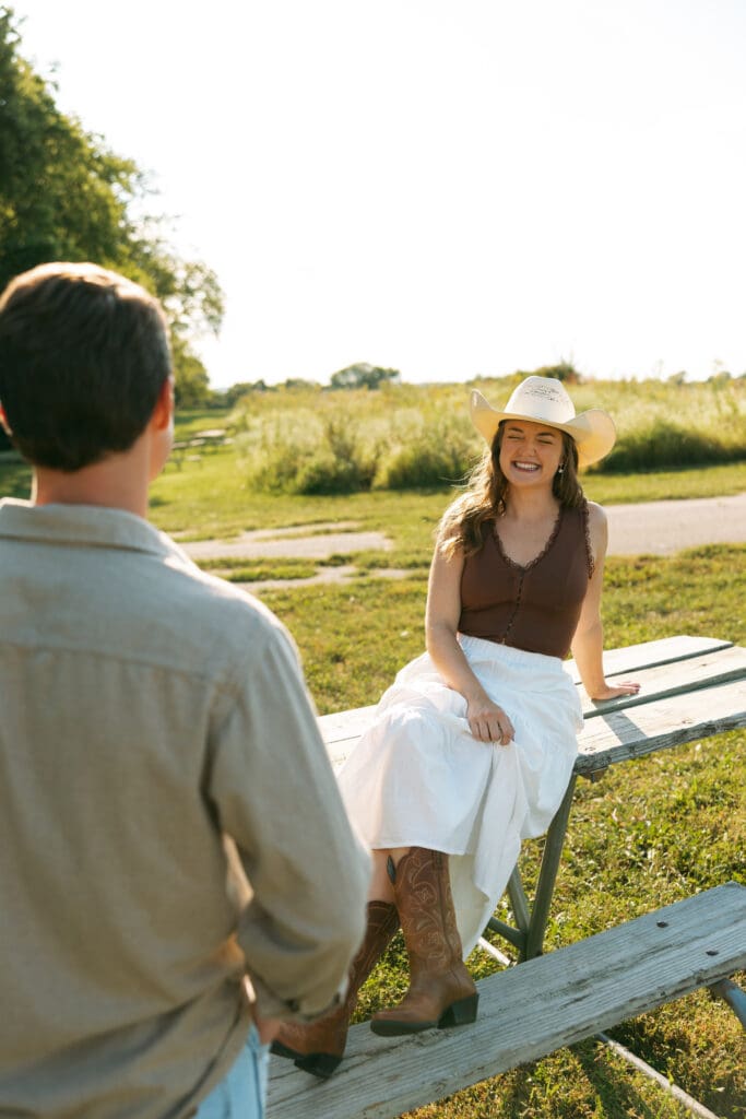 woman and man laughing during engagement session in kansas city