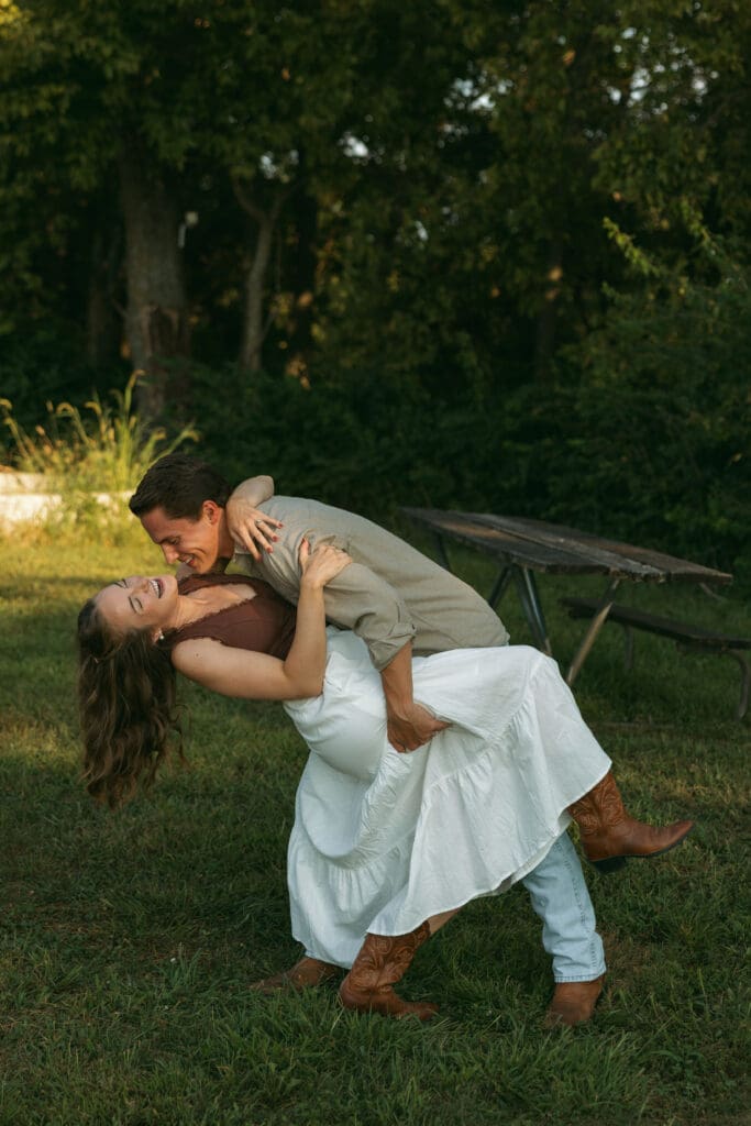 woman and man dancing during engagement session in kansas city