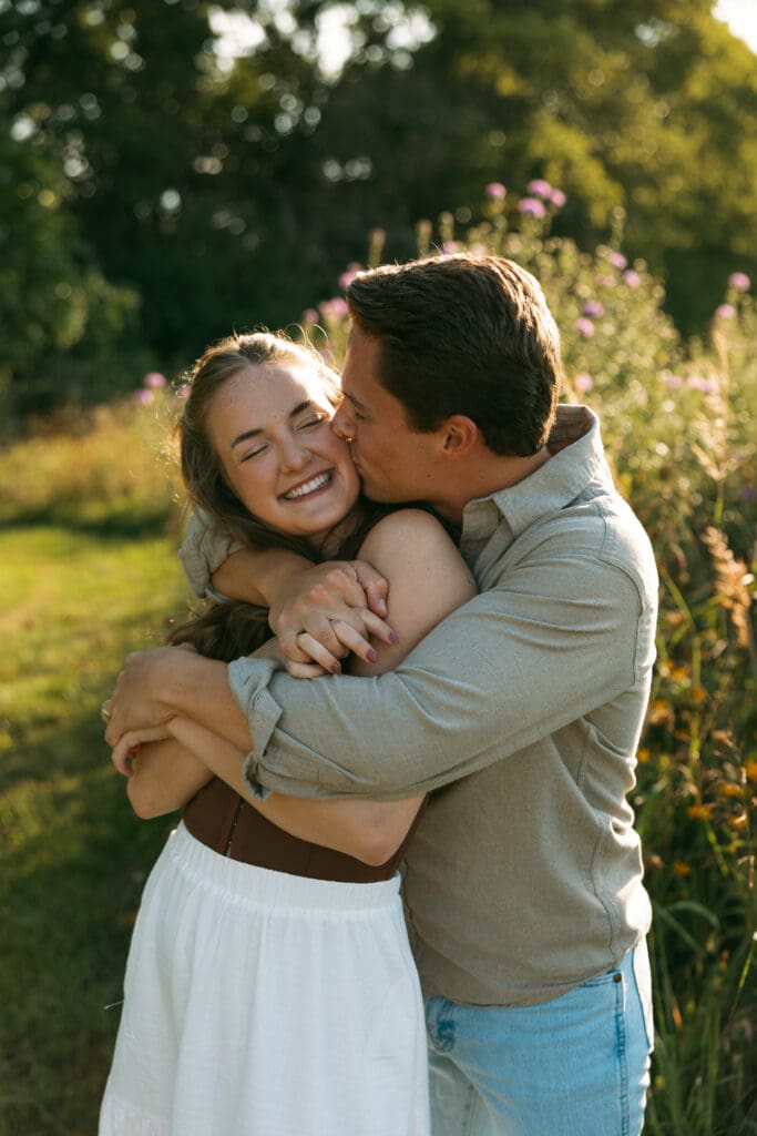 woman and man laughing during engagement session in kansas city