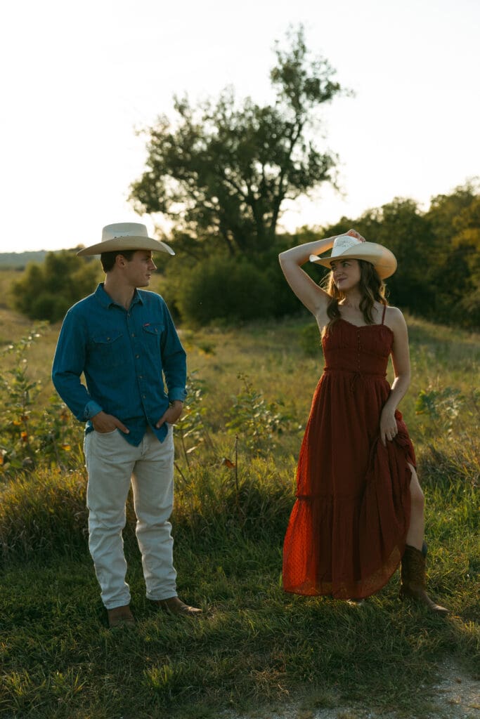 woman and man laughing during engagement session in kansas city