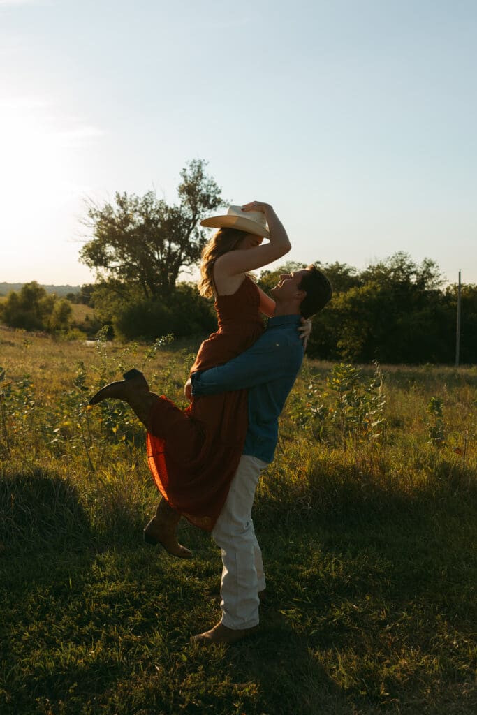 woman and man laughing during engagement session in kansas city
